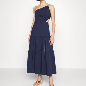 A cut-out detail shapes the waist of Milly’s Baha'i stretch cotton poplin maxi